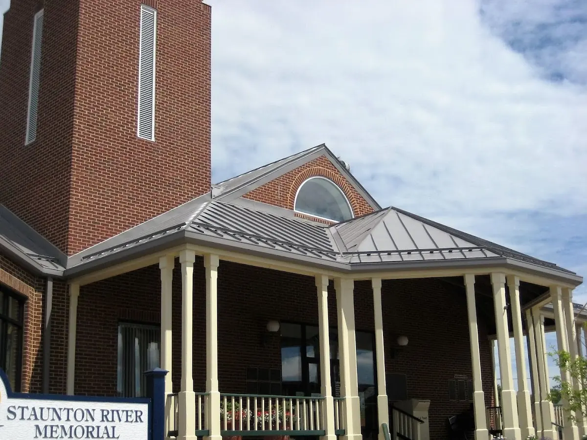 Skilled roofing craftsmen working on a residential roof in Summerville